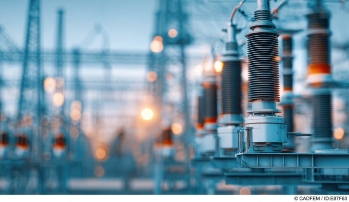 High voltage ceramic insulators in a substation designed for discharge protection | @ Adobe Stock / ID: E87F63
