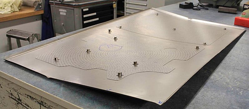 Case of two welded metal sheets losing their planarity